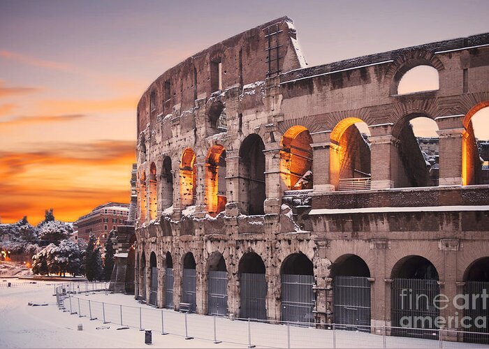 Colosseum Sunset Greeting Card featuring the photograph Colosseum covered in snow at sunset by Stefano Senise