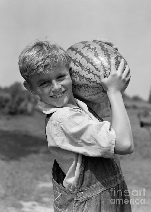 1930s Greeting Card featuring the photograph Farm Boy Carrying Watermelon, C.1930s by H. Armstrong Roberts/ClassicStock