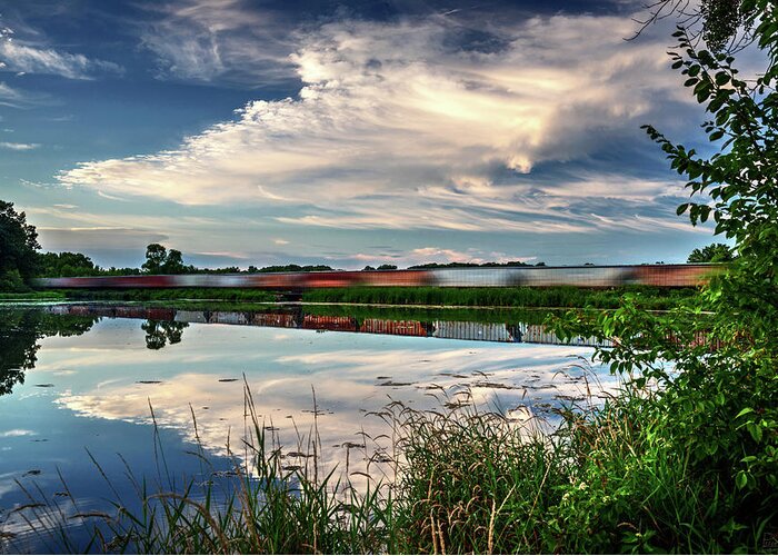 Train Blurred Lake Clouds Reflection Blue Green Horizontal Evansville Wi Wisconsin Lake Leota Leota Park Greeting Card featuring the photograph Frozen Reflections by Peter Herman