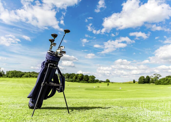 Golf Greeting Card featuring the photograph Golf equipment bag standing on a course. by Michal Bednarek