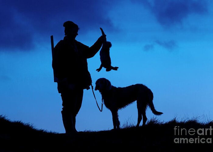Hunter Greeting Card featuring the photograph Hunter with Hare at Sunset by Arterra Picture Library