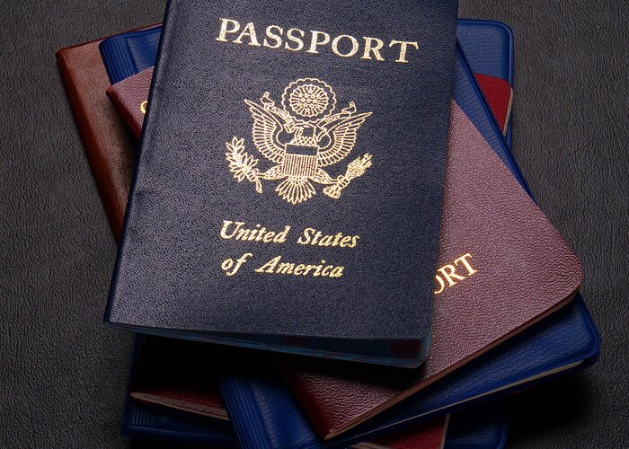Passports Greeting Card featuring the photograph International Passports by Olivier Le Queinec