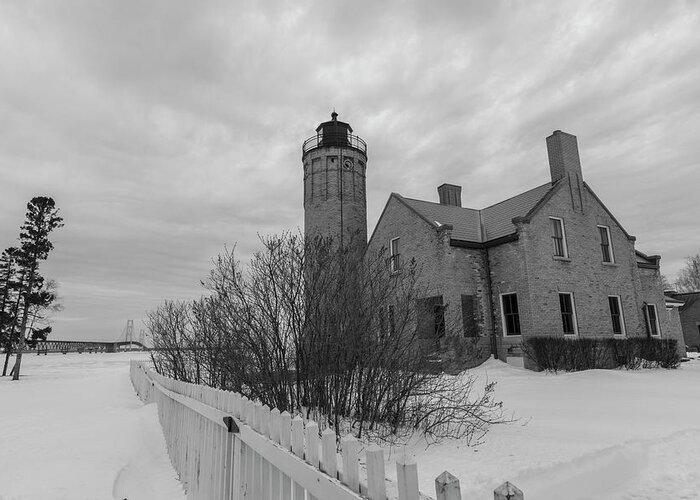 John Mcgraw Greeting Card featuring the photograph Lighthouse and Mackinac Bridge Winter Black and White by John McGraw
