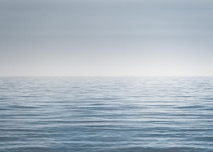 Water Ocean Lake Horizon Blue Monochrome Conceptual Contemplative Waves Infinite Clear Fog Haze Minimal Minimalist Infinity Boundless Far Landscape Wide Panorama Clear Sky Body Of Water No Limit Limitless Manipulated 365 Project Photo A Day Explore Photography Scott Norris Photography Peaceful Greeting Card featuring the photograph Limitless by Scott Norris