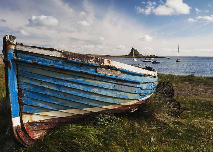 Northumberland Greeting Card featuring the photograph Lindisfarne boats - Landscape. by John Paul Cullen