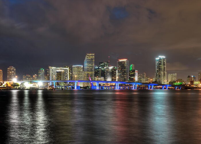The Miami Skyline At Night. This Photograph Was Taken From Watson Island Across From The Miami Children's Museum. Greeting Card featuring the photograph Miami Skyline at Night by Mark Whitt