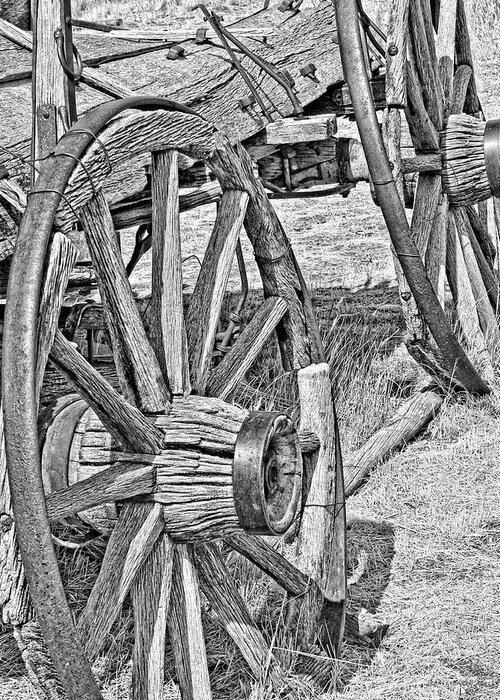Wheel Greeting Card featuring the photograph Montana Old Wagon Wheels Monochrome by Jennie Marie Schell