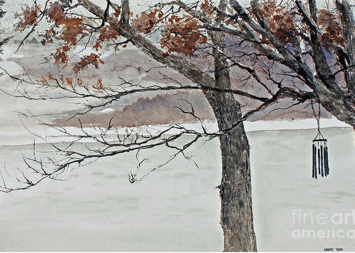 A Black Metal Wind Chime Hangs On A Bare Branch Of A Tree In Winter. A Lake And A Snow Covered Forest Is In The Background. Greeting Card featuring the painting Music Of The North Wind by Monte Toon