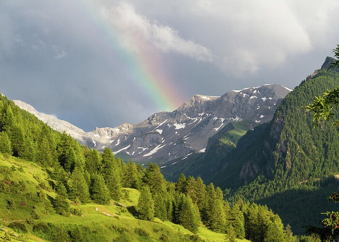 Mountain Landscape Greeting Card featuring the photograph Rainbow over the mountains by Paul MAURICE