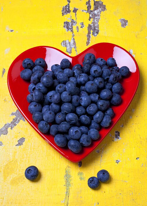 Red Heart Shaped Plate Greeting Card featuring the photograph Red heart plate with blueberries by Garry Gay