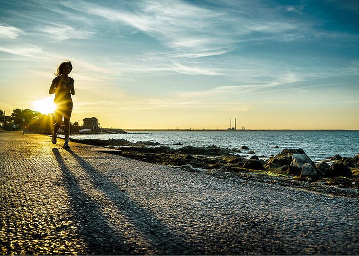 Backlight Greeting Card featuring the photograph Running at sunset - Dublin, Ireland - Color street photography by Giuseppe Milo