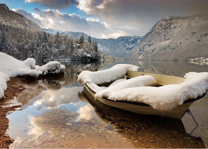 Bohinj Greeting Card featuring the photograph Snow covered boat on Lake Bohinj in Winter by Ian Middleton