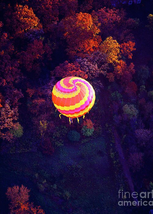 Spiral Greeting Card featuring the photograph Spiral colored hot air balloon over fall tree tops Mchenry  by Tom Jelen