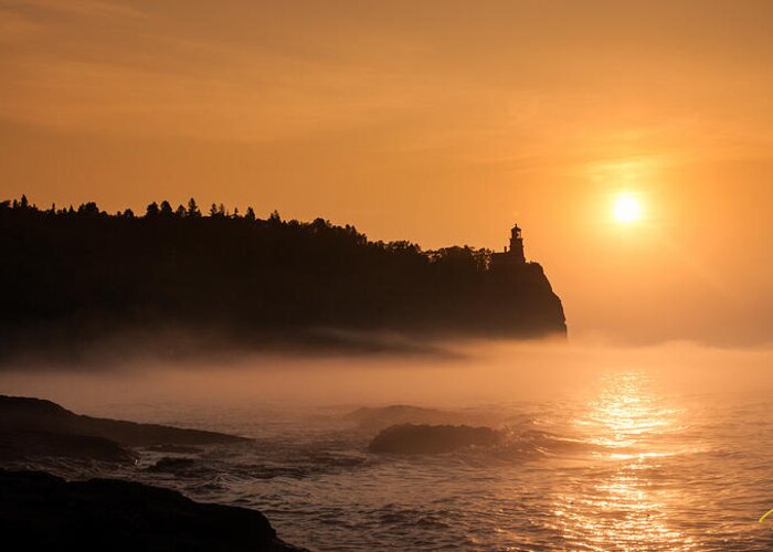 Atmosphere Greeting Card featuring the photograph Split Rock's Morning Glow by Rikk Flohr