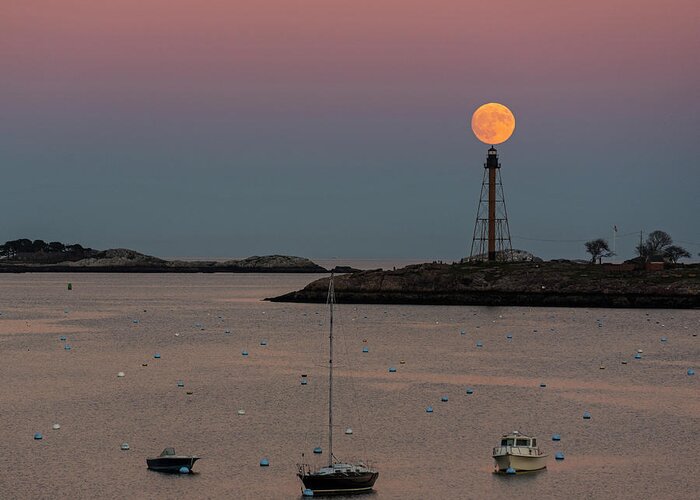 Marblehead Greeting Card featuring the photograph The 2016 Supermoon balancing on the Marblehead Light Tower in Marblehead MA by Toby McGuire