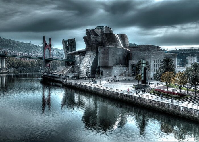 Spain Bilbao Guggenheim Museum Basque Country Frank Gehry Contemporary Architecture Nervion River City Daring And Innovative Curves Building Exterior Spectacular Building Deconstructivism Ferrovial Clad In Glass Greeting Card featuring the photograph The Guggenheim Museum Bilbao Surreal by Andy Myatt