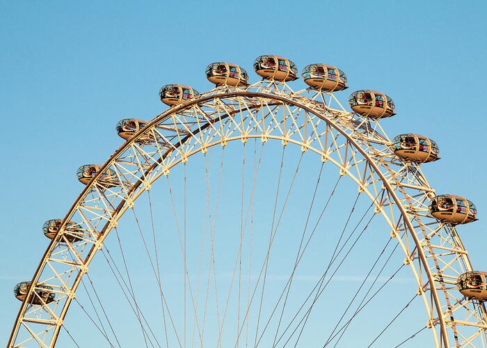 London Eye Greeting Card featuring the photograph The London Eye ferris wheel against a cold blue winter sky by Chris Warham