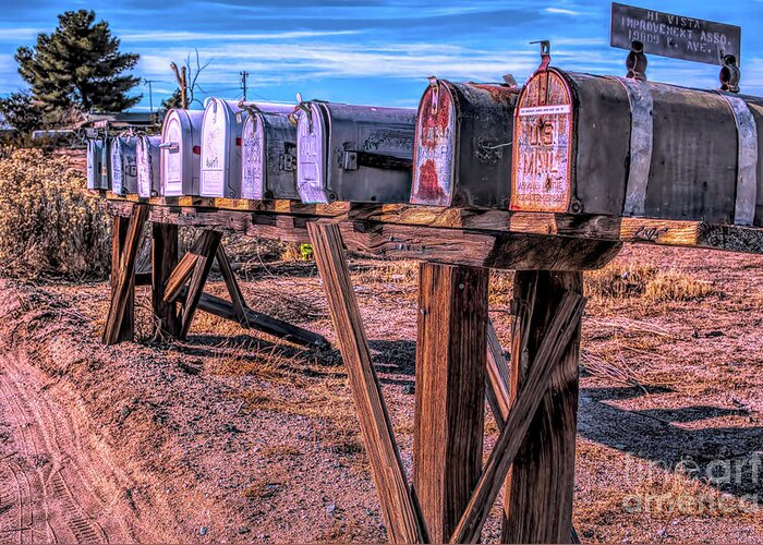 Mailboxes; Row Of Mailboxes; Mojave Desert; Colorful; Blue; Red; Yellow; Brown; Green; Trees; Joe Lach Greeting Card featuring the photograph The Mailboxes by Joe Lach