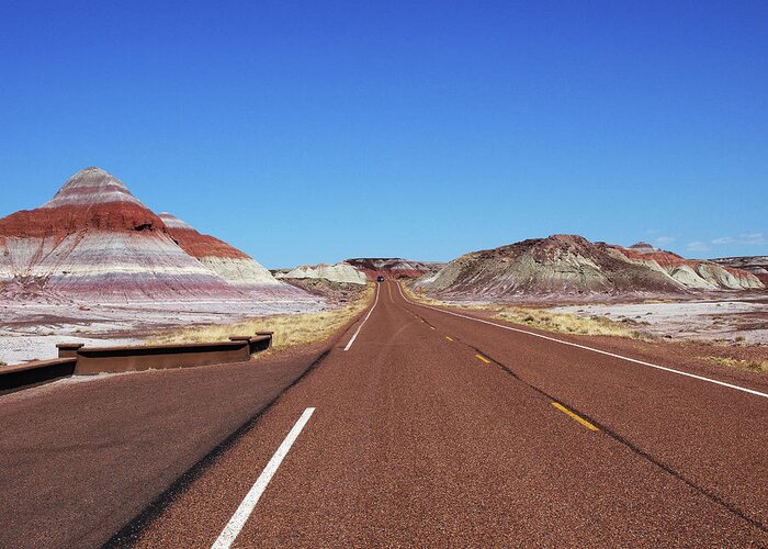 Arizona Greeting Card featuring the photograph The Road through the Painted Desert by Mary Capriole