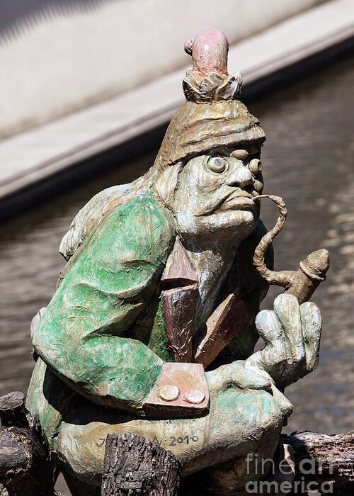 Prague Greeting Card featuring the photograph The water goblin statue guarding Velkoprerovsky Mill on Certovka or Devil's stream. Prague, Czech Republic by Michal Bednarek