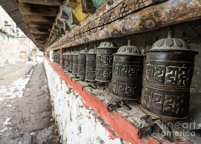 Ancient Greeting Card featuring the photograph Tibetan Buddhism prayer wheels in Manang by Didier Marti
