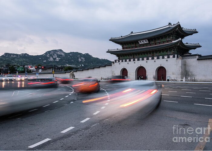 Ancient Greeting Card featuring the photograph Traffic rushing in front of the Gyeongbokgung palace in Seoul by Didier Marti