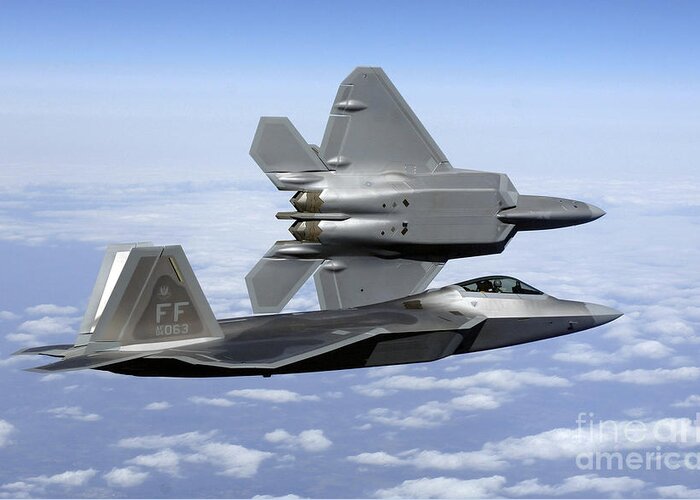 Aircraft Greeting Card featuring the photograph Two F-22a Raptors In Flight by Stocktrek Images