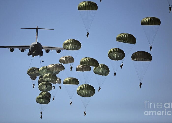 Parachutist Greeting Card featuring the photograph U.s. Army Paratroopers Jumping by Stocktrek Images