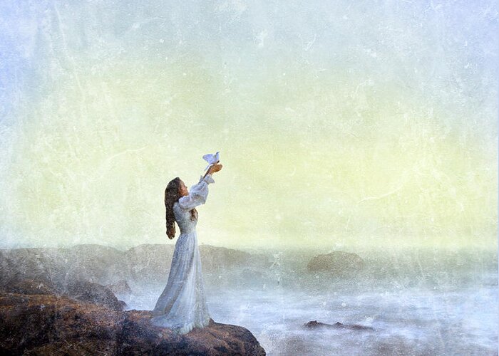 Woman Greeting Card featuring the photograph Young Lady Releasing a Dove by the Sea by Jill Battaglia