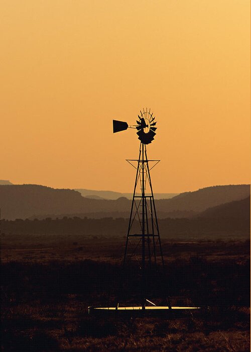 Tranquility Greeting Card featuring the photograph A Desert Windmill At Sunset #1 by Wesley Hitt