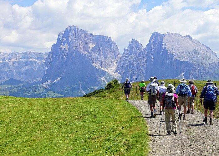Italy Greeting Card featuring the photograph Hikers walking towards the Langkofel #1 by Steve Estvanik
