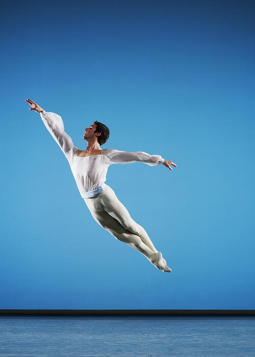 Ballet Dancer Greeting Card featuring the photograph Male Ballet Dancer Leaping On Stage #1 by Thomas Barwick