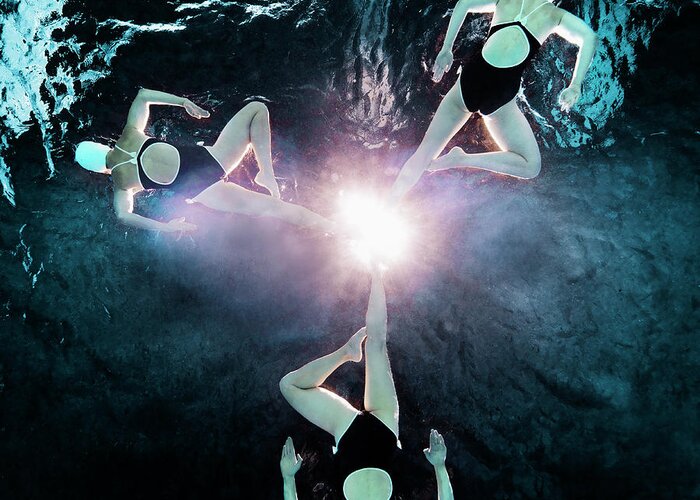 Underwater Greeting Card featuring the photograph Three Synchronised Swimmers In Formation #1 by Henrik Sorensen