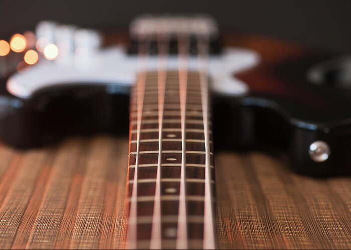 Rock Music Greeting Card featuring the photograph Close Up Of Bass Guitar #2 by Daniel Grill
