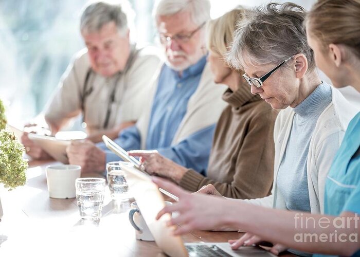 Indoors Greeting Card featuring the photograph Seniors Using Tablets With Carer #2 by Science Photo Library