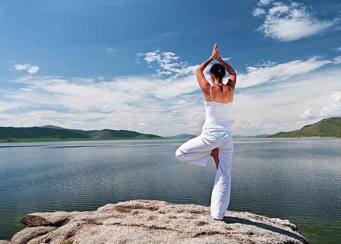 Scenics Greeting Card featuring the photograph Young Woman Practicing Yoga #2 by Hadynyah