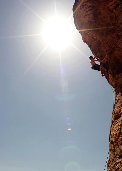 Recreational Pursuit Greeting Card featuring the photograph A Rock Climber Ascends A Red Rock Face #28 by Jared Mcmillen