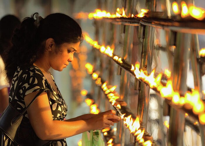 Devotee Lighting Candles At Sunset In The Temple Of The Sacred Tooth Relic (temple Of The Tooth) Greeting Card featuring the photograph 83-12459 by Robert Harding Picture Library