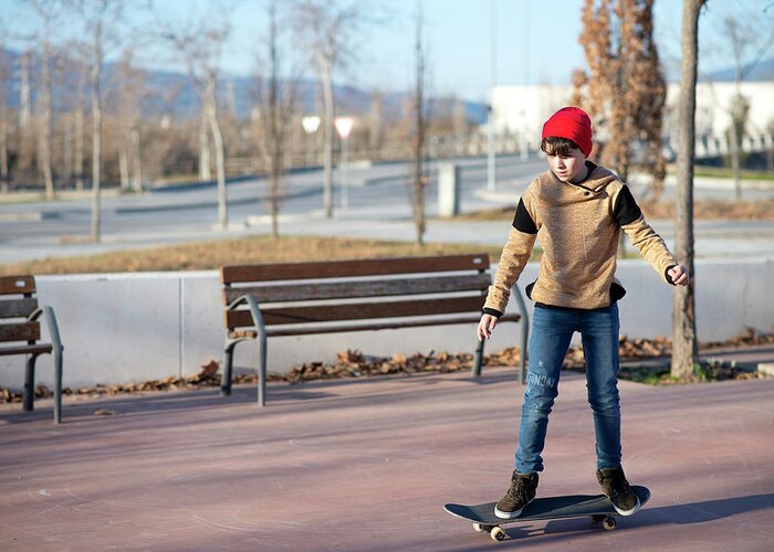 Male Greeting Card featuring the photograph Male Skateboarder Riding And Practicing Skateboard In City Outdoors #9 by Cavan Images