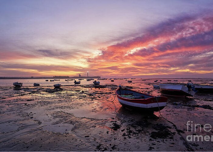 Shore Greeting Card featuring the photograph Boats at La Caleta Beach at Dusk under a Fiery Sky Cadiz by Pablo Avanzini