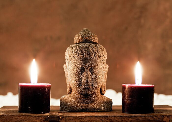 Statue Greeting Card featuring the photograph Buddha Statue And Candles by Aluxum