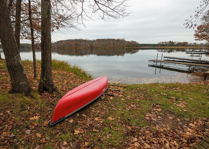 Fall Greeting Card featuring the photograph Canoe On Shore In The Fall by Cavan Images