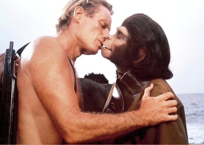 Charlton Heston Greeting Card featuring the photograph CHARLTON HESTON and KIM HUNTER in PLANET OF THE APES -1968-. by Album