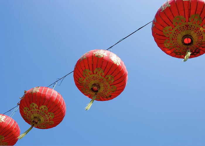 Chinese Culture Greeting Card featuring the photograph Chinese Lanterns Against Blue Sky by Stephen Studd
