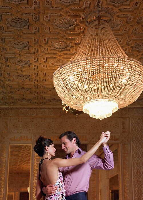 Heterosexual Couple Greeting Card featuring the photograph Couple Dancing Beneath Chandelier, Low by Justin Pumfrey