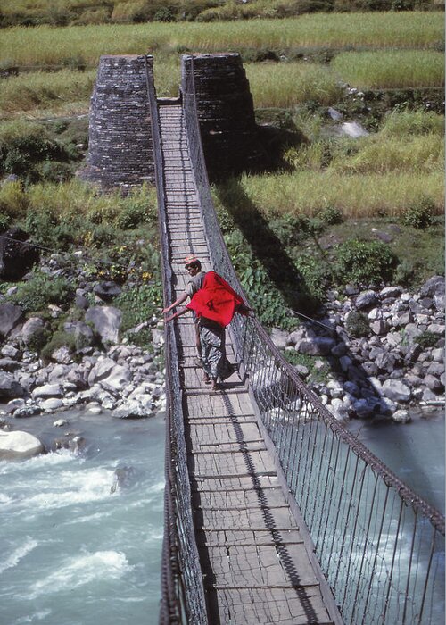 Nepal Greeting Card featuring the photograph Crossing a suspension bridge by Steve Estvanik