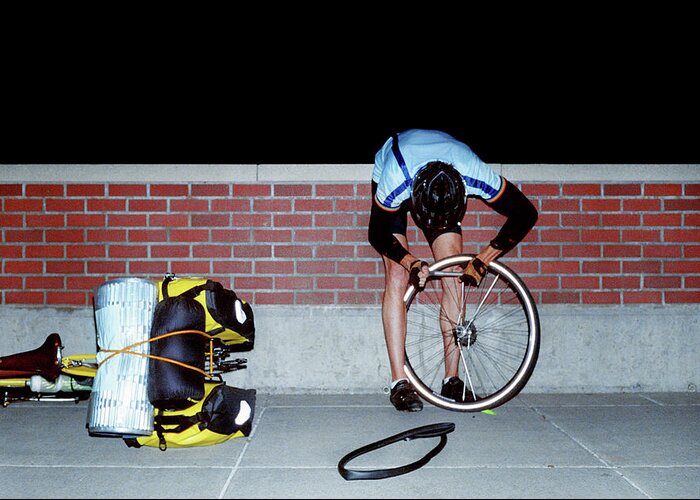 Problems Greeting Card featuring the photograph Cyclist Fixing Flat Tire by Brad Wenner