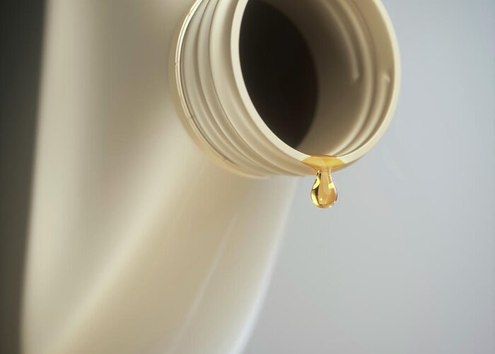 Nobody Greeting Card featuring the photograph Engine Oil Dripping From A Bottle by Ktsdesign/science Photo Library