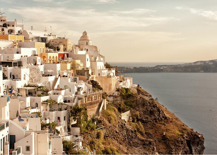 Tranquility Greeting Card featuring the photograph Fira Santorini In The Warm Sunset Light by Ralucahphotography.ro