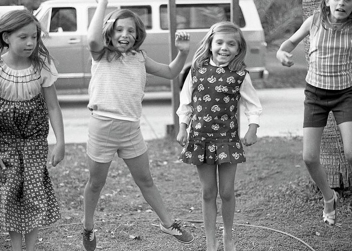 Jumping Greeting Card featuring the photograph Four Girls, Jumping, 1972 by Jeremy Butler